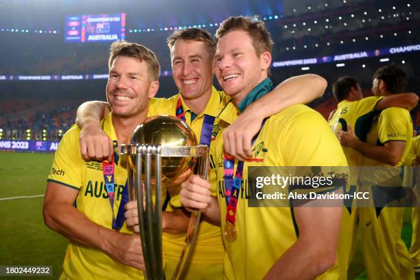 David Warner, Marnus Labuschagne and Steve Smith of Australia poses with the ICC Men's Cricket World Cup Trophy following the ICC Men's Cricket World...