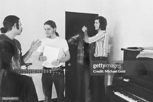 Cast of 'Lemmings' Christopher Guest, Paul Jacobs, John Belushi, obscured, and Chevy Chase, rehearsing in a rehearsal hall in New York City, circa...