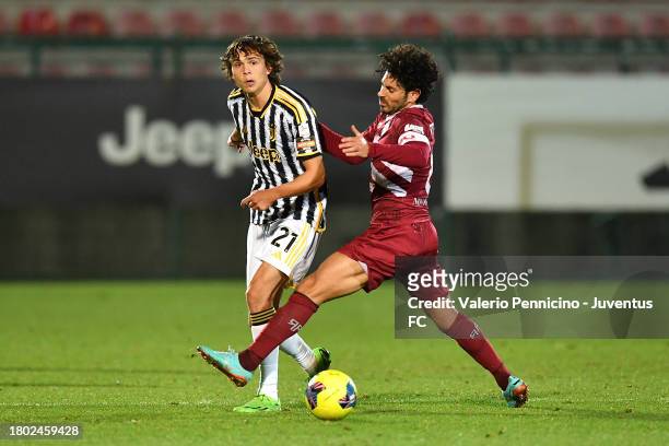Martin Palumbo of Juventus Next Gen is challenged during the Serie C match between Juventus Next Gen and Arezzo at Stadio Giuseppe Moccagatta on...