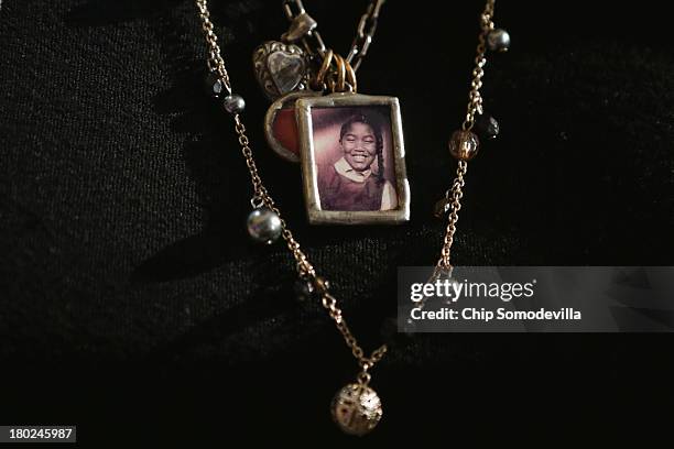 Diane Robertson Braddock wears a necklace with the image of her sister, Carole Robertson, who was one of the four young girls who were killed in the...