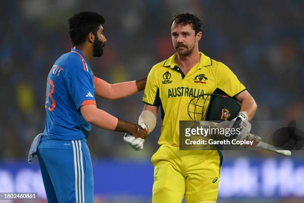 Travis Head of Australia shakes hands with Jasprit Bumrah of India as he leaves the field after being dismissed for 137 runs during the ICC Men's...