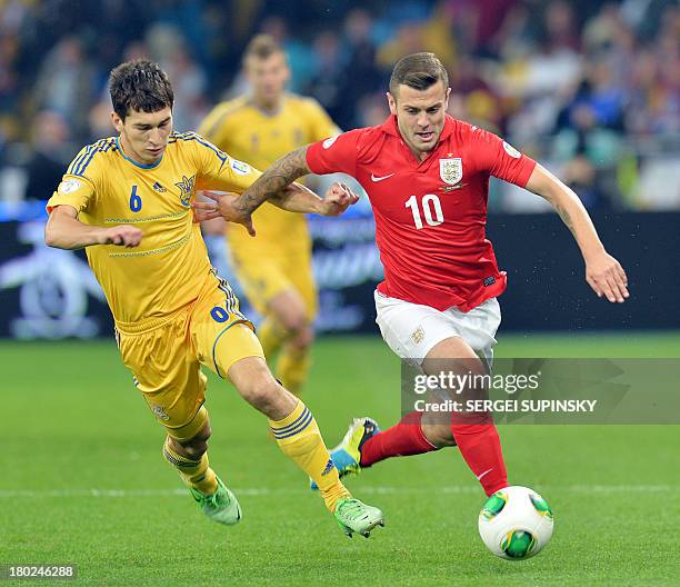 Jack Wilshere of England fights for the ball with Taras Stepanenko of Ukraine during their Brazil 2014 FIFA World Cup qualifiers, Group H, football...