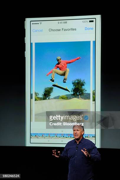 Philip Schiller, senior vice president of worldwide marketing at Apple Inc., introduces a new iPhone 5S during a product announcement in Cupertino,...
