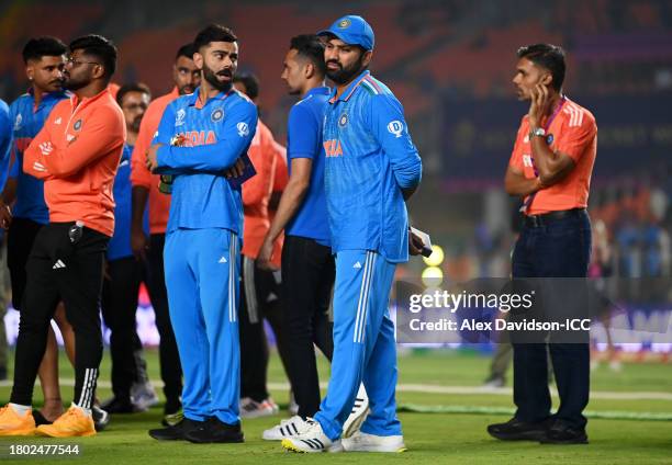 Virat Kohli and Rohit Sharma of India cut dejected figures following the ICC Men's Cricket World Cup India 2023 Final between India and Australia at...