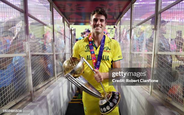 Pat Cummins of Australia poses with the ICC Men's Cricket World Cup Trophy following the ICC Men's Cricket World Cup India 2023 Final between India...