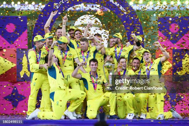 Pat Cummins of Australia lifts the ICC Men's Cricket World Cup Trophy following the ICC Men's Cricket World Cup India 2023 Final between India and...