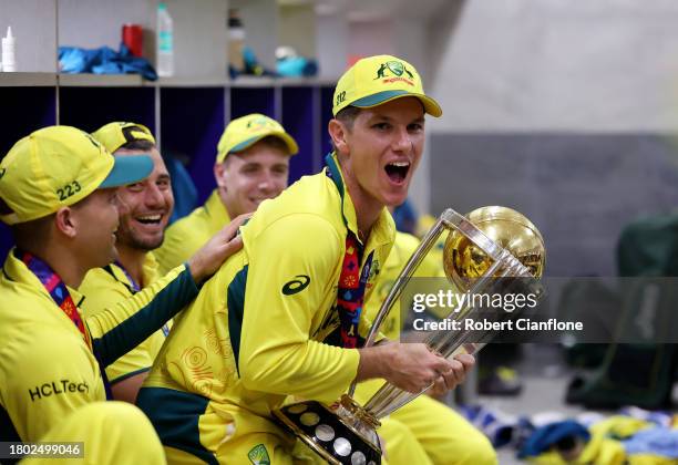 Adam Zampa of Australia poses with the ICC Men's Cricket World Cup Trophy following the ICC Men's Cricket World Cup India 2023 Final between India...