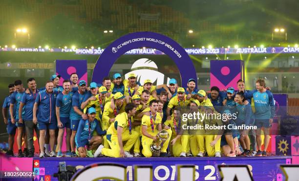 Pat Cummins of Australia lifts the ICC Men's Cricket World Cup Trophy following the ICC Men's Cricket World Cup India 2023 Final between India and...