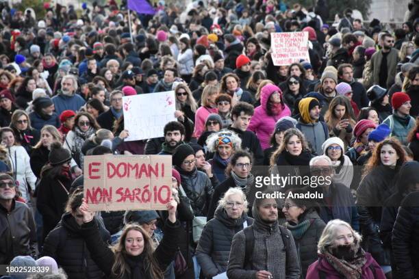 Protesters walk past the Colosseum during a demonstration against violence on women in Rome, Italy, on November 25, 2023. Hundred of thousands people...