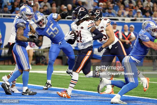 Onta Foreman of the Chicago Bears scores a first quarter touchdown against the Detroit Lions at Ford Field on November 19, 2023 in Detroit, Michigan.