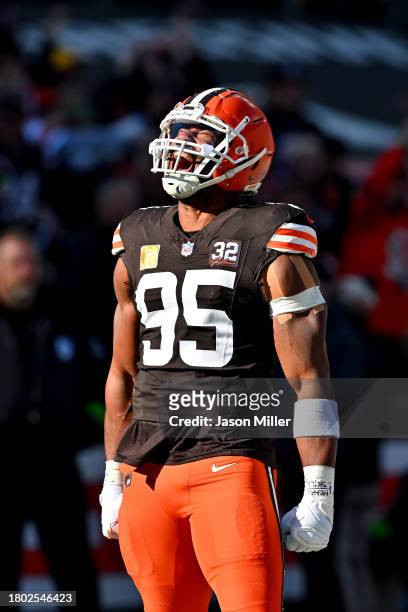 Myles Garrett of the Cleveland Browns celebrates after recording a sack in the first quarter against the Pittsburgh Steelers at Cleveland Browns...