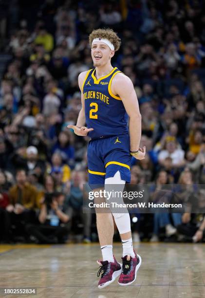 Brandin Podziemski of the Golden State Warriors reacts after making a three-point shot against the Oklahoma City Thunder during the second half of an...