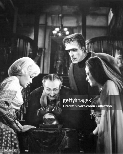 Members of the Munster family in a publicity still for season one of the comedy-horror TV series 'The Munsters', 1964. Left to right: Beverley Owen...