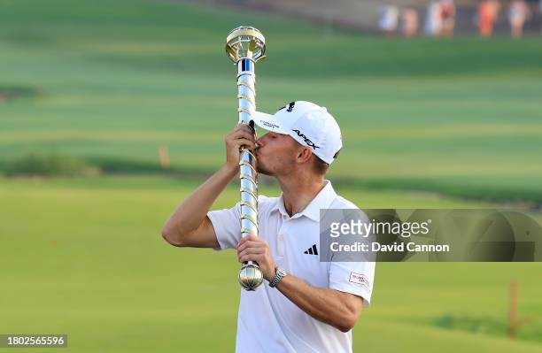 Nicolai Hojgaard of Denmark kisses the DP World Tour Championship trophy after his win during the final round on Day Four of the of the DP World Tour...