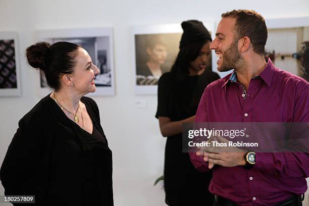 Designer Sophie Theallet and Micah Jesse speak at the American Express VIP Card Member Lounge at MADE Fashion Week Spring 2014 at Milk Studios on...