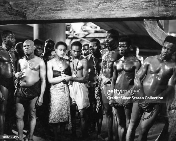 Group of chained African slaves on board a slave ship in a publicity still for 'Song Of Freedom', directed by J. Elder Wills, 1936.