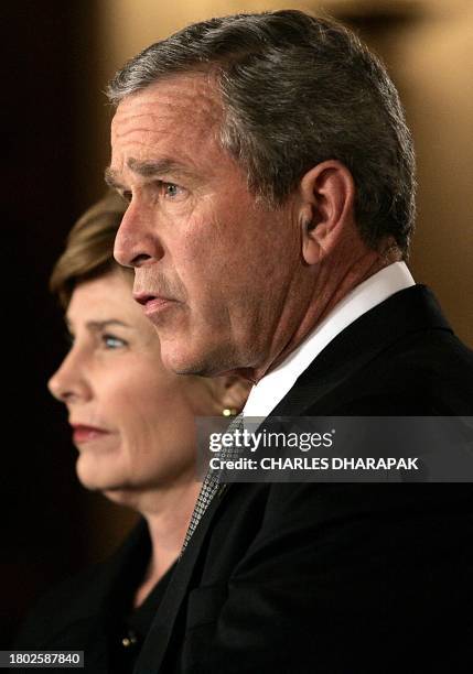 President George W. Bush, accompanied by First Lady Laura Bush, pays tribute to Pope John Paul II from The White House 02 April in Washington, DC....