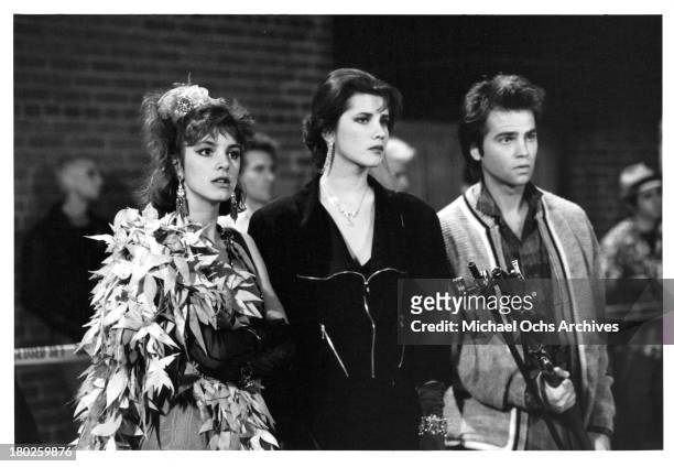 Actresses Cynthia Gibb, Daphne Zuniga with actor Clayton Rohner on set of the Atlantic Releasing movie "Modern Girls" in 1986.