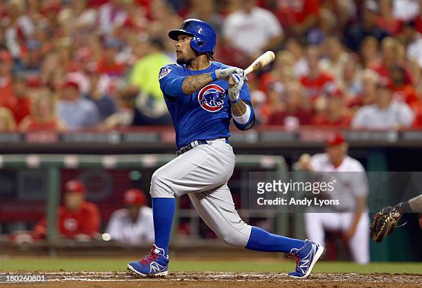 Darnell McDonald of the Chicago Cubs hits a run scoring single in the third inning during the game against the Cincinnati Reds at Great American Ball...
