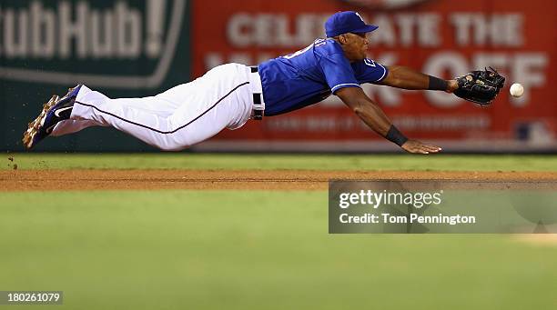 Texas Rangers third baseman Adrian Beltre dives for a ground ball hit by Pittsburgh Pirates right fielder Marlon Byrd in the top of the fifth innin...