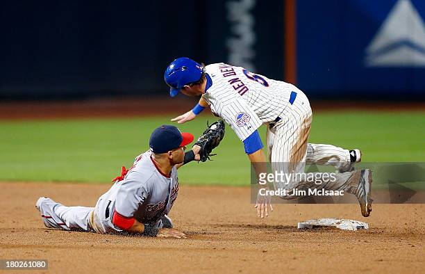 Matt den Dekker of the New York Mets is caught stealing second base in the sixth inning by Ian Desmond of the Washington Nationals at Citi Field on...