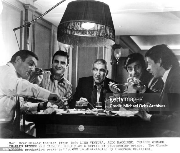 Actors Lino Ventura, Aldo Maccione, Charles Gerard and Charles Denner and Jacque Brel on set of Cinerama Releasing movie " Money, Money, Money" .