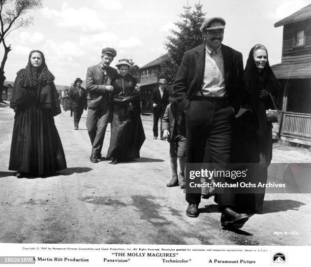 Actor Richard Harris , actress Samantha Eggar walk behind actor Sean Connery and actress Bethel Leslie on set of the Paramount Pictures movie "The...