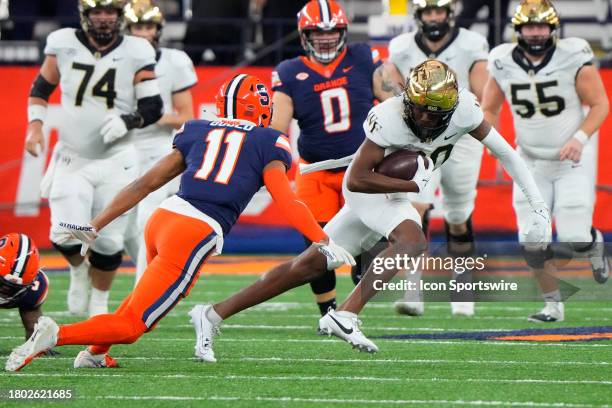 Wake Forest Demon Deacons Wide Receiver Jahmal Banks runs with the ball after making a catch against Syracuse Orange Defensive Back Jaeden Gould...
