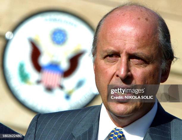 File photo taken 30 June 2004 shows new United States Ambassador to Iraq John Negroponte speaking prior to a flag raising ceremony at the U.S....