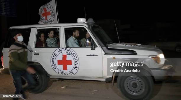 Screen grab captured from a video shows vehicle carrying released Israeli hostages to the Rafah border as part of the exchange agreement during the...