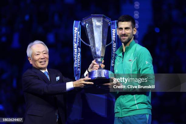 Novak Djokovic of Serbia receives the Nitto ATP Finals trophy after victory against Jannik Sinner of Italy in the Men's Singles Finals between Jannik...