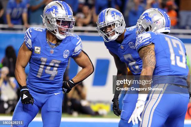 Amon-Ra St. Brown of the Detroit Lions celebrates a second quarter touchdown during a game against the Chicago Bears at Ford Field on November 19,...