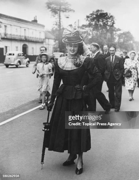 Elizabeth Shelley wearing a peplum jacket and three-quarter-length skirt on the first day of the Royal Ascot race-meeting, Ascot, Berkshire, 15th...