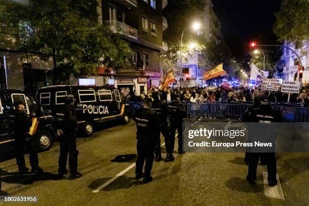 Demonstrators clash with police during a demonstration against the amnesty in front of the PSOE headquarters in Ferraz, on 19 November, 2023 in...