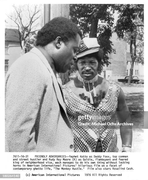 Actors Yaphet Kotto and Rudy Ray Moore on set for the movie " The Monkey Hu$tle" in 1976.