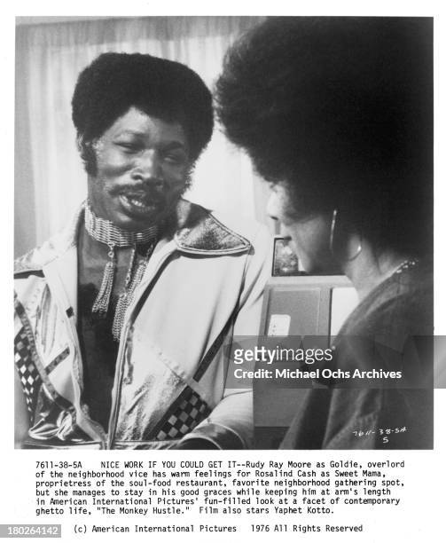 Actor Rudy Ray Moore and actress Rosalind Cash on set for the movie " The Monkey Hu$tle" in 1976.