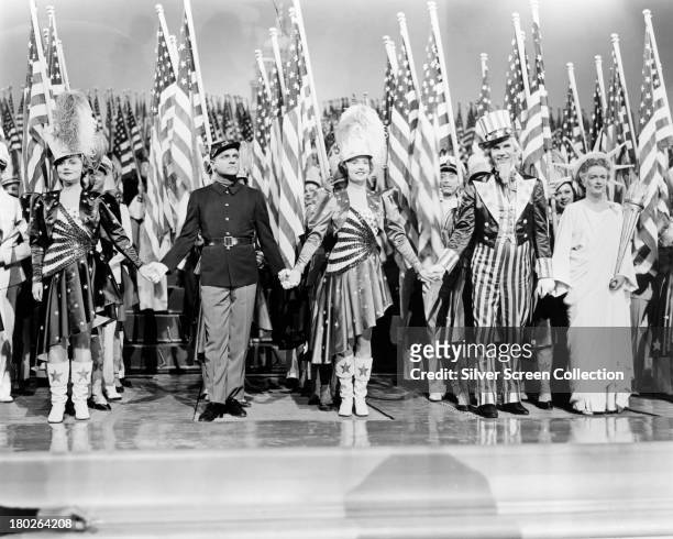 American actors Jeanne Cagney , James Cagney , Joan Leslie, Walter Huston , and Rosemary DeCamp , in 'Yankee Doodle Dandy', directed by Michael...