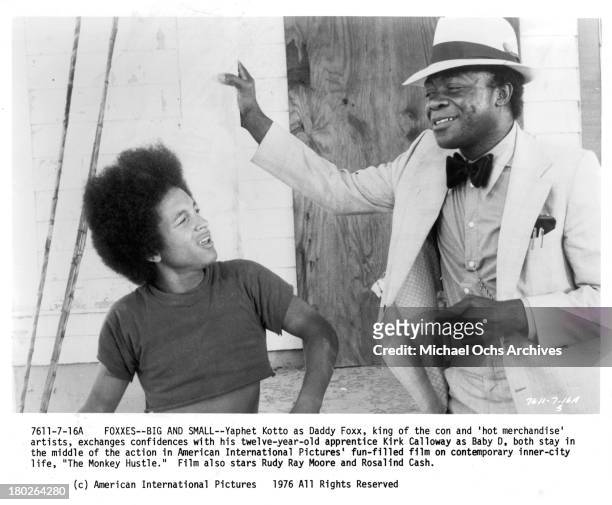 Actors Kirk Calloway and Yaphet Kotto on set for the movie " The Monkey Hu$tle" in 1976.