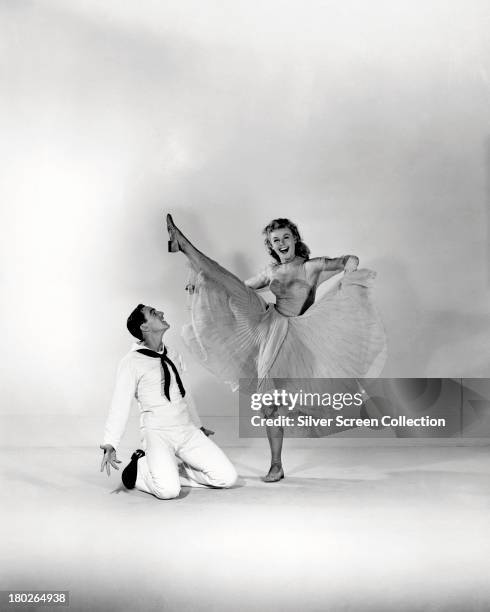 American actors and dancers Gene Kelly and Vera-Ellen in a promotional still for 'On The Town', directed by Kelly and Stanley Donen, 1949.