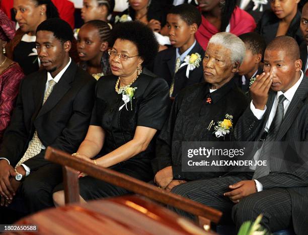 Former South African President Nelson Mandela and his family attend a memorial service for his son Makgatho Mandela, who died of AIDS 06 January in...