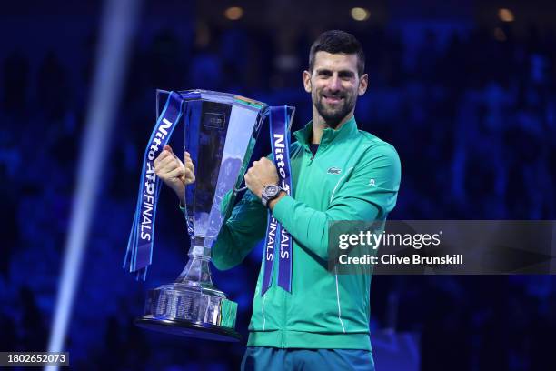 Novak Djokovic of Serbia poses for a photo with the Nitto ATP Finals trophy after victory against Jannik Sinner of Italy in the Men's Singles Finals...