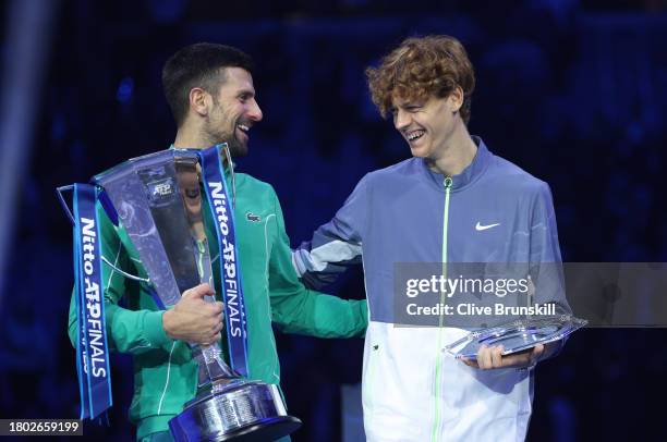 Novak Djokovic of Serbia and Jannik Sinner of Italy react following the Men's Singles Finals between Jannik Sinner of Italy and Novak Djokovic of...