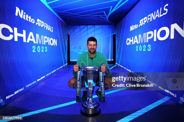 Novak Djokovic of Serbia poses for a photo with the Nitto ATP Finals trophy after victory against Jannik Sinner of Italy in the Men's Singles Finals...