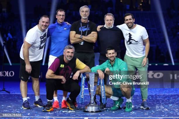 Novak Djokovic of Serbia poses for a photo with the Nitto ATP Finals trophy andtheir team after victory against Jannik Sinner of Italy in the Men's...