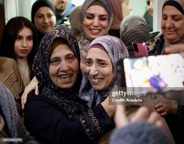 Palestinian prisoner Shuruk Duveyat who has been released from Israeli jail, reunits with her family after prisoner swap amid humanitarian pause...