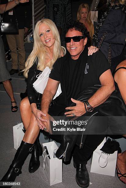 Michaele Salahi and Neal Schon attend the Zang Toi show during Spring 2014 Mercedes-Benz Fashion Week at The Stage at Lincoln Center on September 10,...