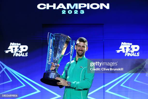 Novak Djokovic of Serbia poses for a photo with the Nitto ATP Finals trophy after victory against Jannik Sinner of Italy in the Men's Singles Finals...