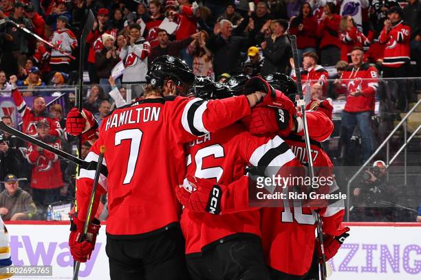 Alexander Holtz of the New Jersey Devils celebrates his goal with teammates in the first period of the game against the Buffalo Sabres at the...