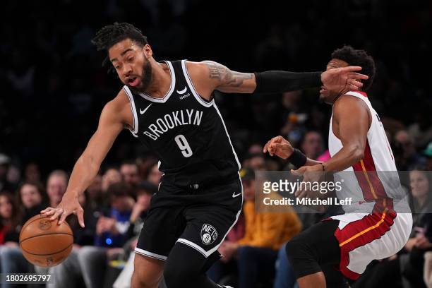Trendon Watford of the Brooklyn Nets drives to the basket against Kyle Lowry of the Miami Heat in the first half at Barclays Center on November 25,...