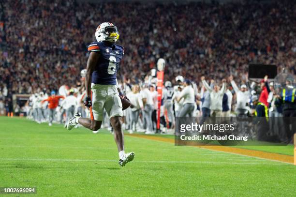 Wide receiver Ja'Varrius Johnson of the Auburn Tigers runs the ball in to the end zone for a touchdown during the second half of their game against...